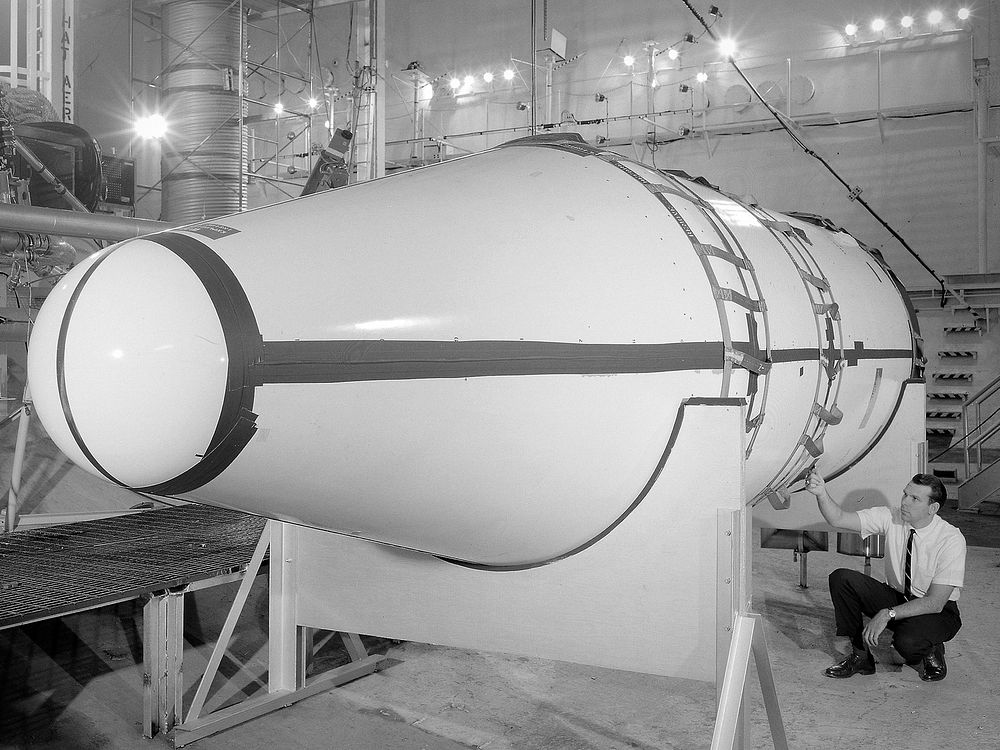 Setup of a Surveyor/Atlas/Centaur shroud venting structural test in the Space Power Chambers for a leak test at NASA.…