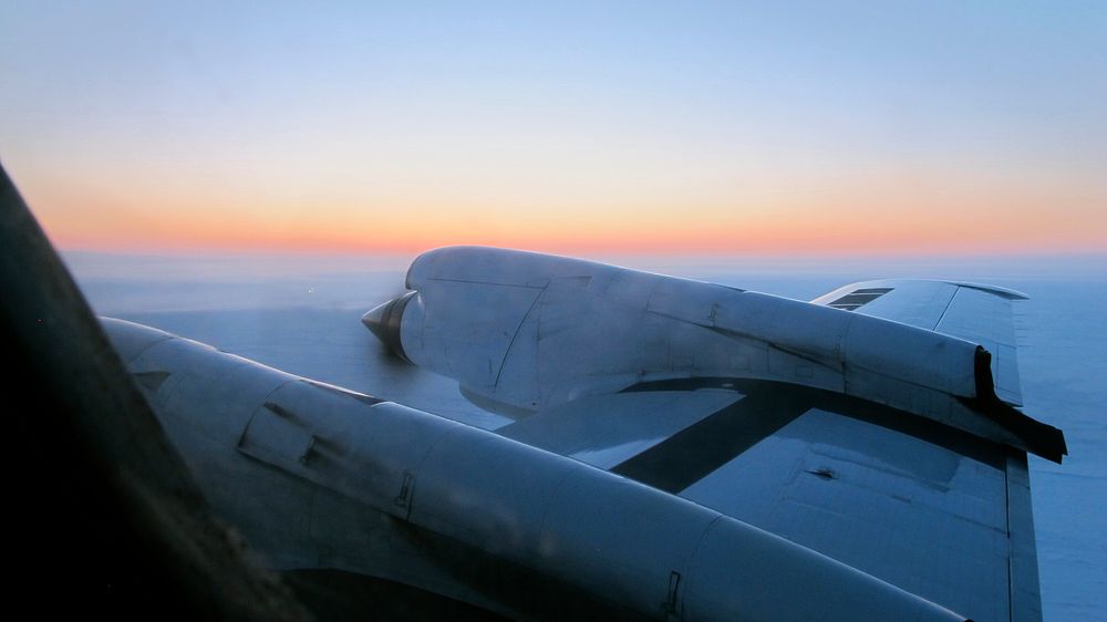 View just before sunrise over the Arctic Ocean during IceBridge's transit flight from Fairbanks to Thule. Original from NASA…