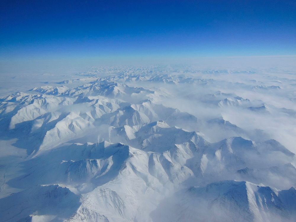 Alaskan mountains seen from high altitude. Original from NASA. Digitally enhanced by rawpixel.