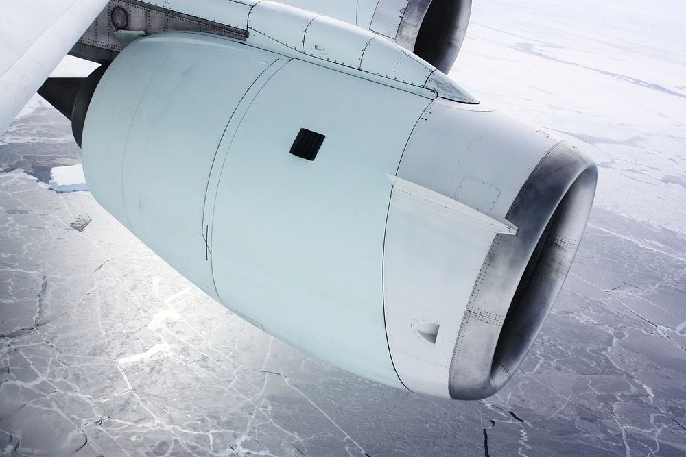 One of the engines of NASA's DC-8 airborne laboratory above sea ice in the Bellingshausen Sea. Original from NASA. Digitally…