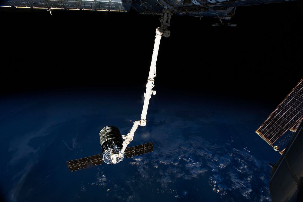 The International Space Station&rsquo;s Canadarm2 prepares to release the Orbital Sciences' Cygnus commercial cargo craft…