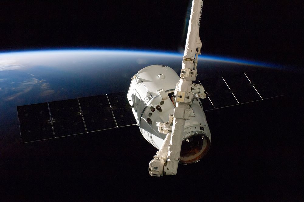 The SpaceX Dragon commercial cargo craft is grappled by the International Space Station&rsquo;s Canadarm2 robotic arm. Oct…