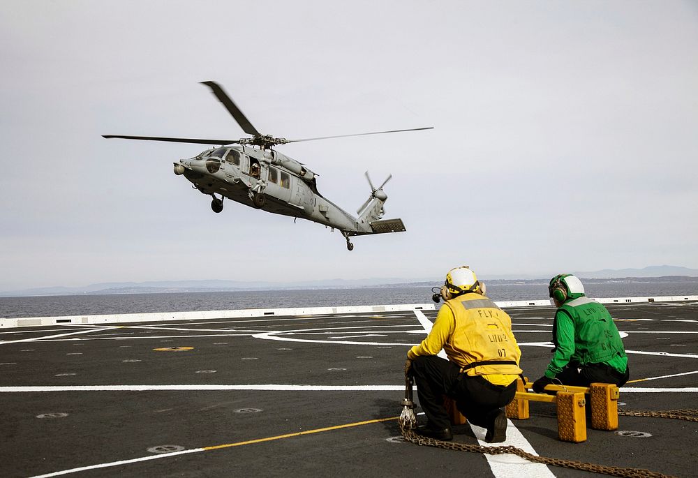 An H60-S Seahawk helicopter lands on the deck of the USS Anchorage in the Pacific Ocean off the coast of California.…