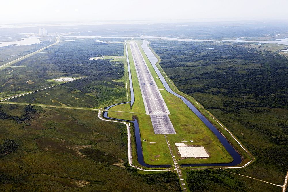 This aerial view shows the 15,000-foot long Shuttle Landing Facility at the Kennedy Space Center, Fla. Original from NASA.…