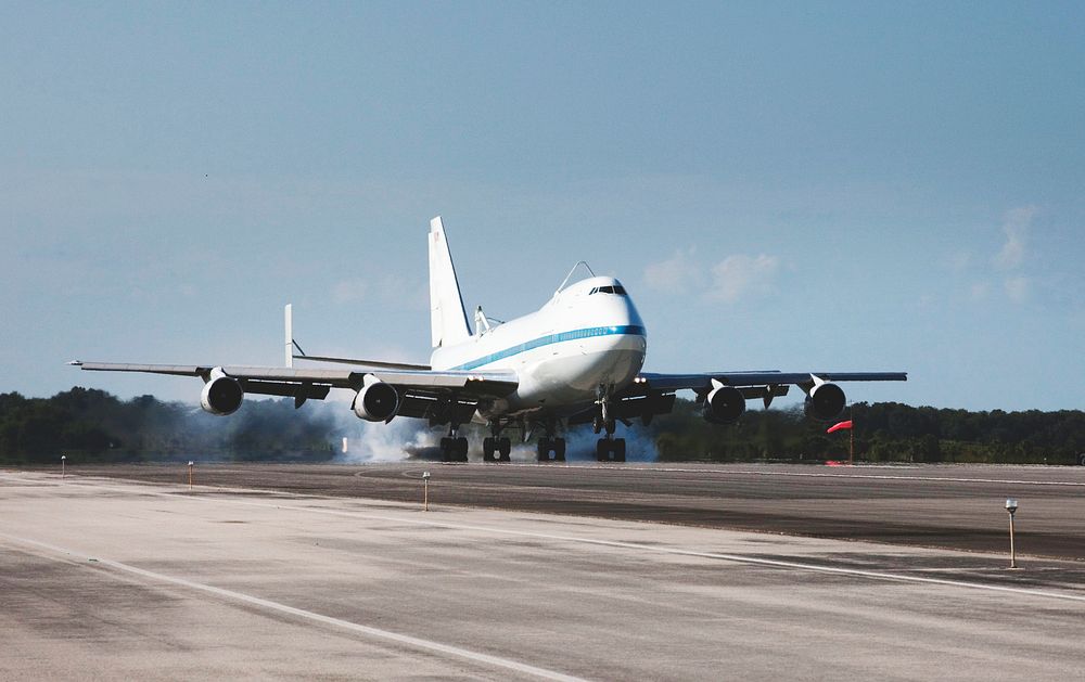 The Shuttle Carrier Aircraft, or SCA, touches down on the runway at NASA Kennedy Space Center&rsquo;s Shuttle Landing…