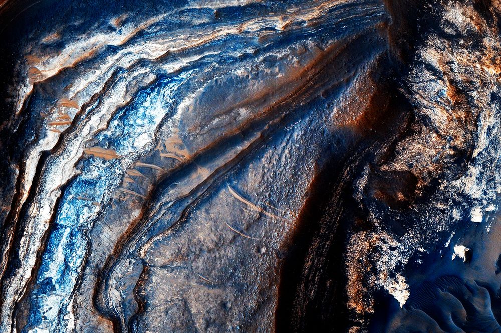 Over 300 meters of layered beds are exposed in this trough of Noctis Labyrinthus. Original from NASA. Digitally enhanced by…