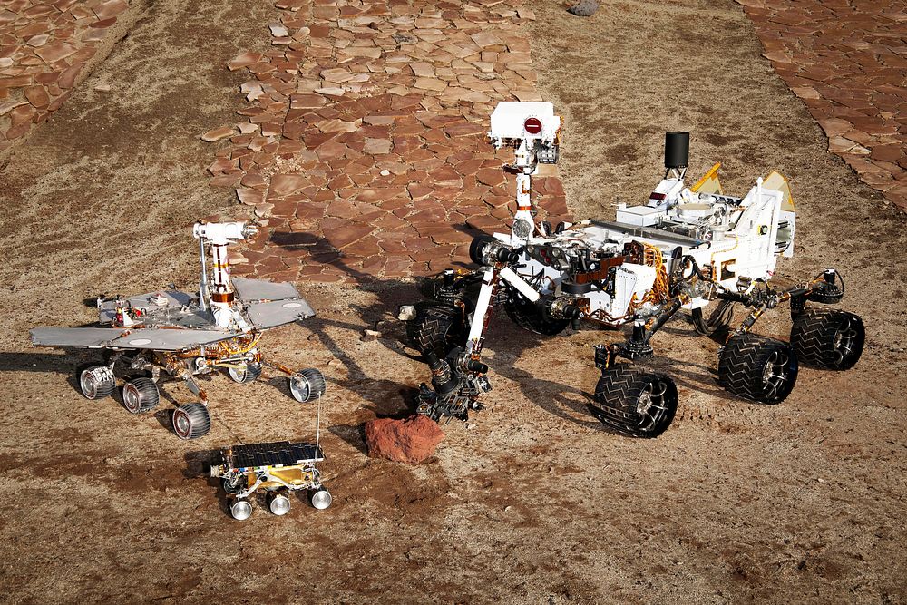 This grouping of two test rovers and a flight spare provides a graphic comparison of three generations of Mars rovers…