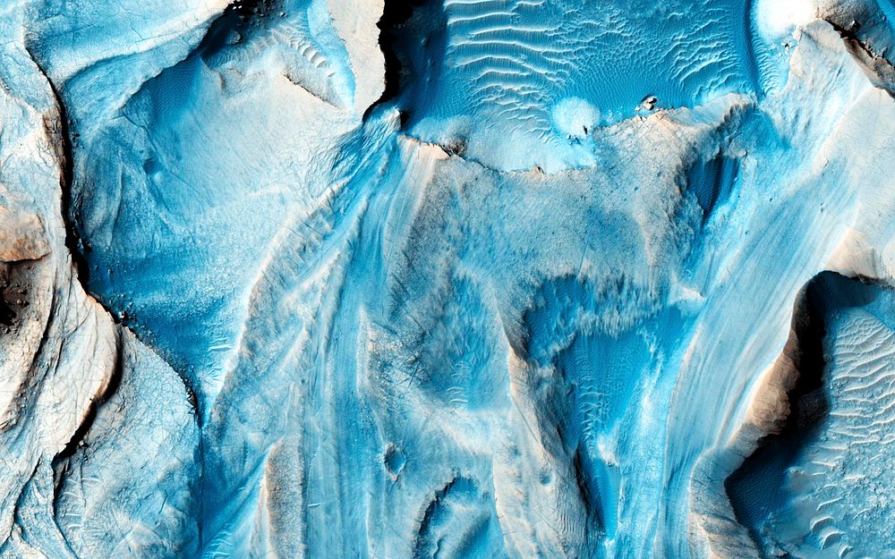 This observation from NASA's Mars Reconnaissance Orbiter covers an outcrop of possible cyclic bedding within a crater in…