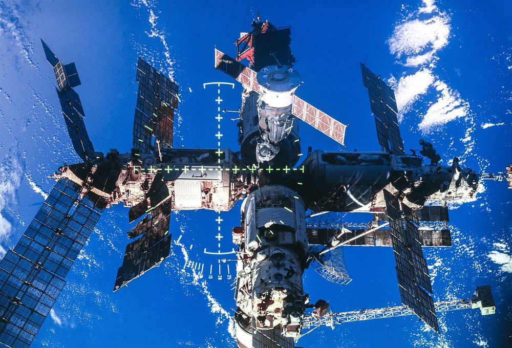 Full views of Mir Space Station after undocking during flyaround. Original from NASA . Digitally enhanced by rawpixel.