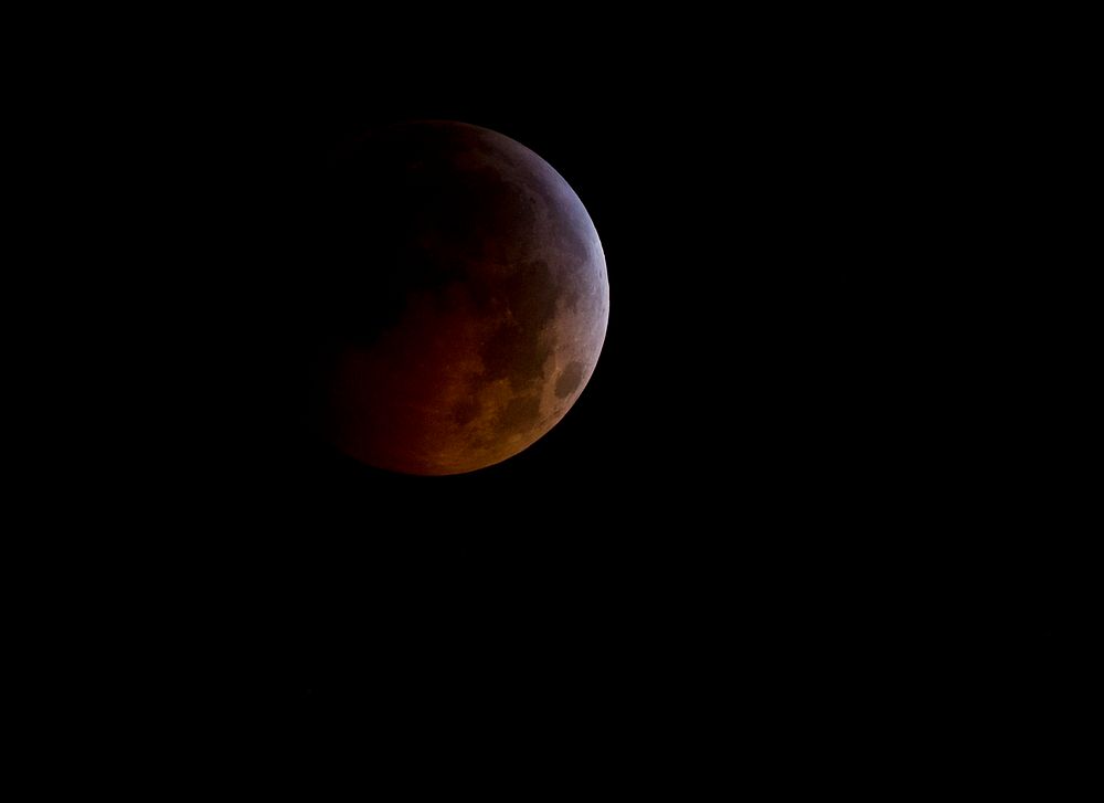 A total lunar eclipse is seen as the full moon is shadowed by the Earth on the arrival of the winter solstice, December 21…