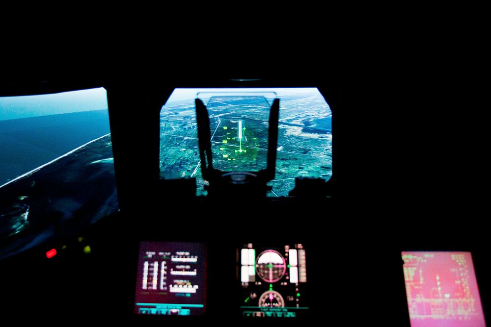 The landing approach to the Kennedy Space Center is seen in a heads up display as the crew of STS-135 trains in the Vertical…