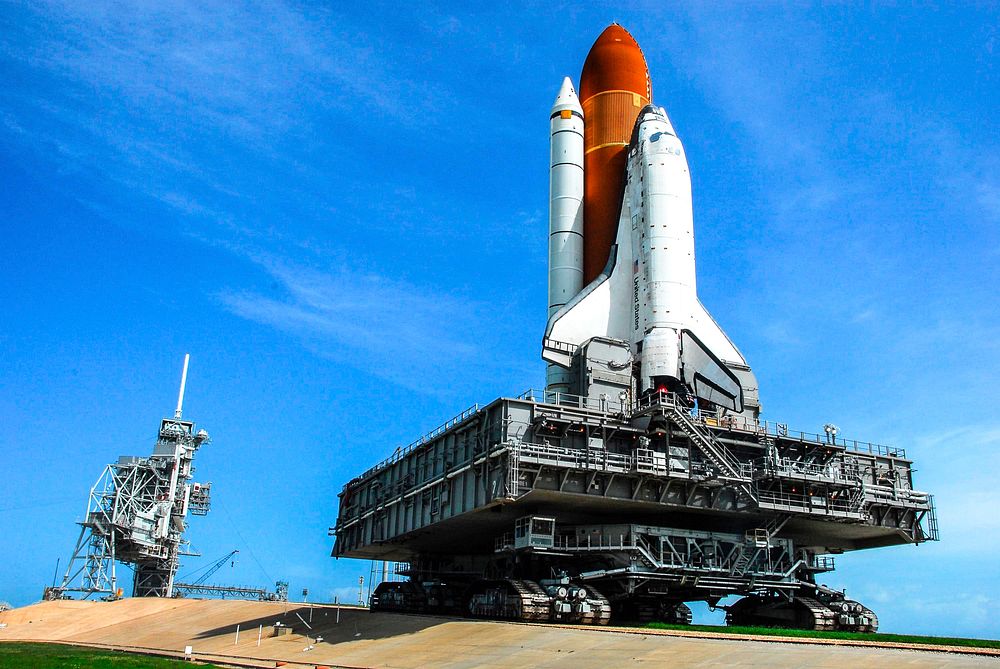 Space Shuttle Discovery climbs the five percent grade to the top of the hardstand at Launch Pad 39A. Original from NASA.…