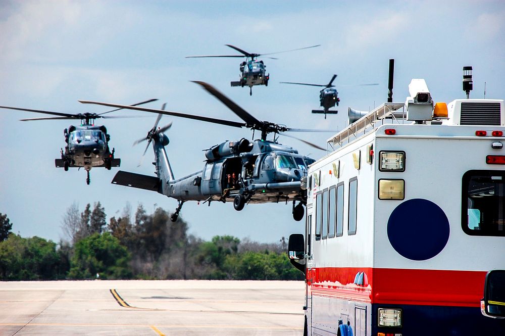 Helicopters with medical personnel arrive at the Shuttle Landing Facility at NASA's Kennedy Space Center in Florida before…