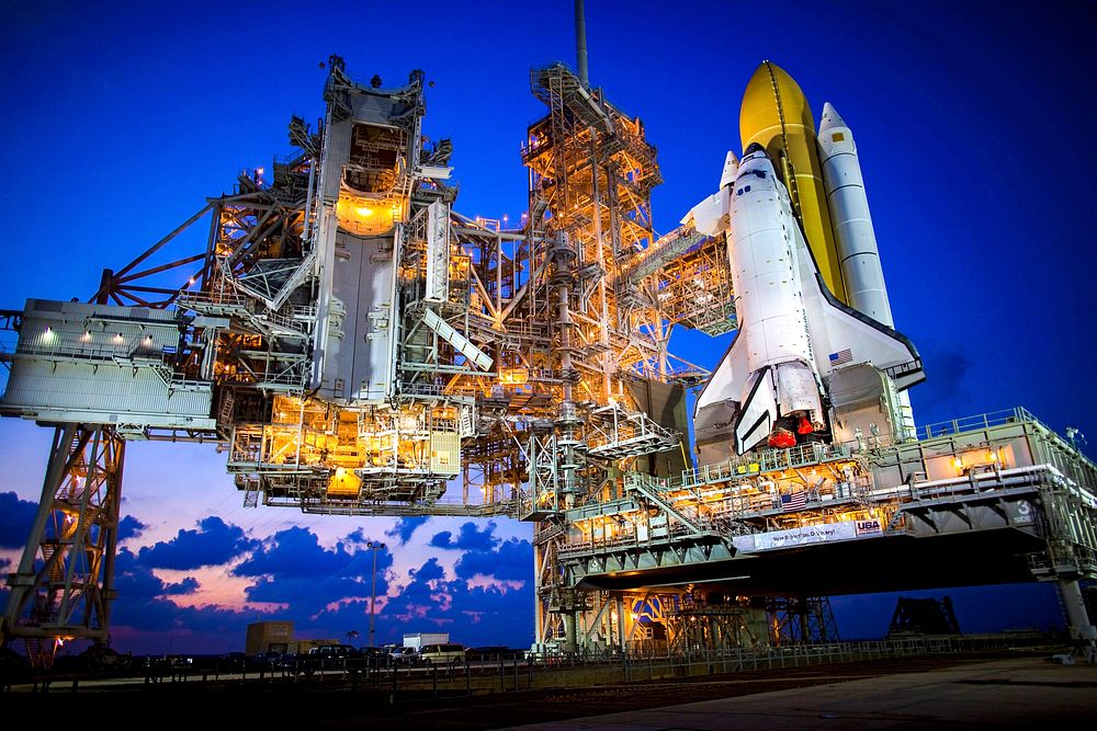 Space shuttle Discovery stands tall on Launch Pad 39A as the sun sets over NASA's Kennedy Space Center in Florida. Original…