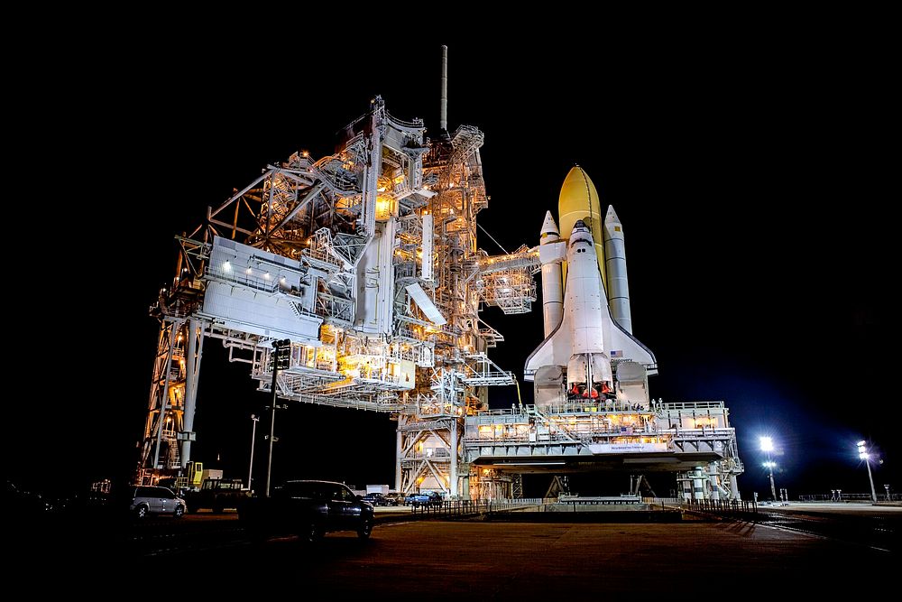 Space shuttle Discovery stands tall on Launch Pad 39A at NASA's Kennedy Space Center in Florida as space center workers…