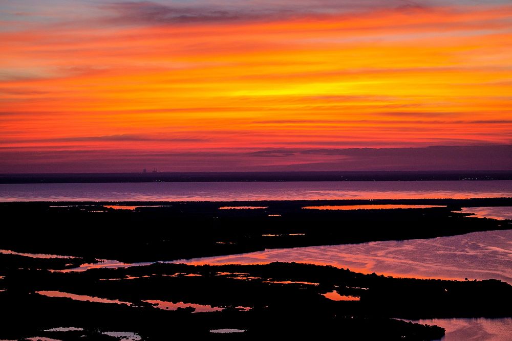 A perfect sunset over NASA's Kennedy Space Center in Florida. Original from NASA. Digitally enhanced by rawpixel.