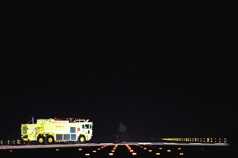 A NASA Fire Rescue truck, which is part of the landing convoy at NASA's Kennedy Space Center in Florida, heads out toward…
