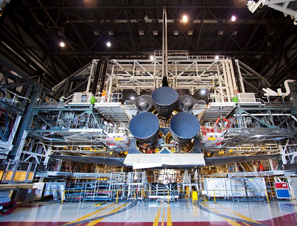 Space shuttle Discovery sports three replica shuttle main engines (RSMEs) in Orbiter Processing Facility-1 at NASA&rsquo;s…