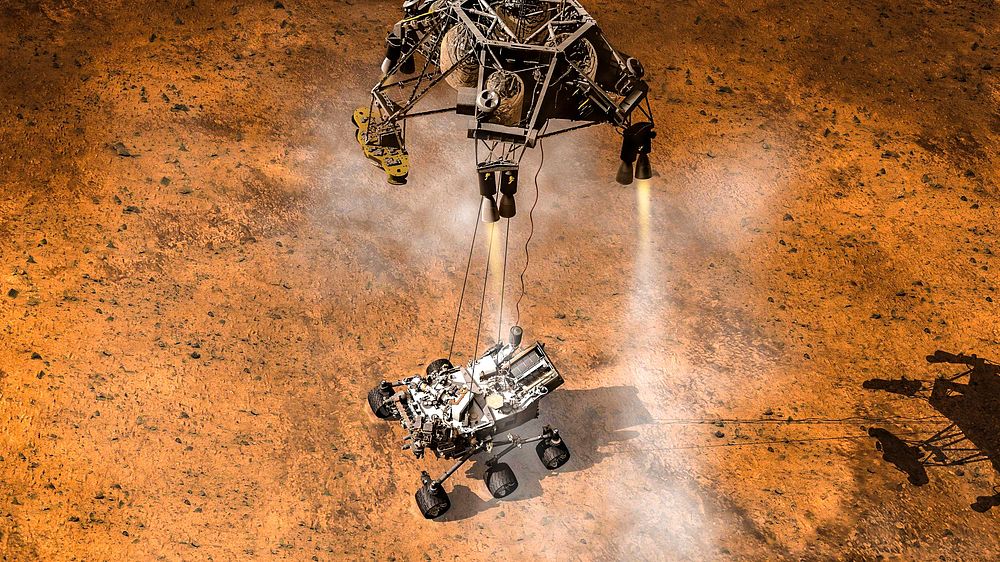 Artist concept depicts the moment that NASA Curiosity rover touches down onto the Martian surface using the sky crane…