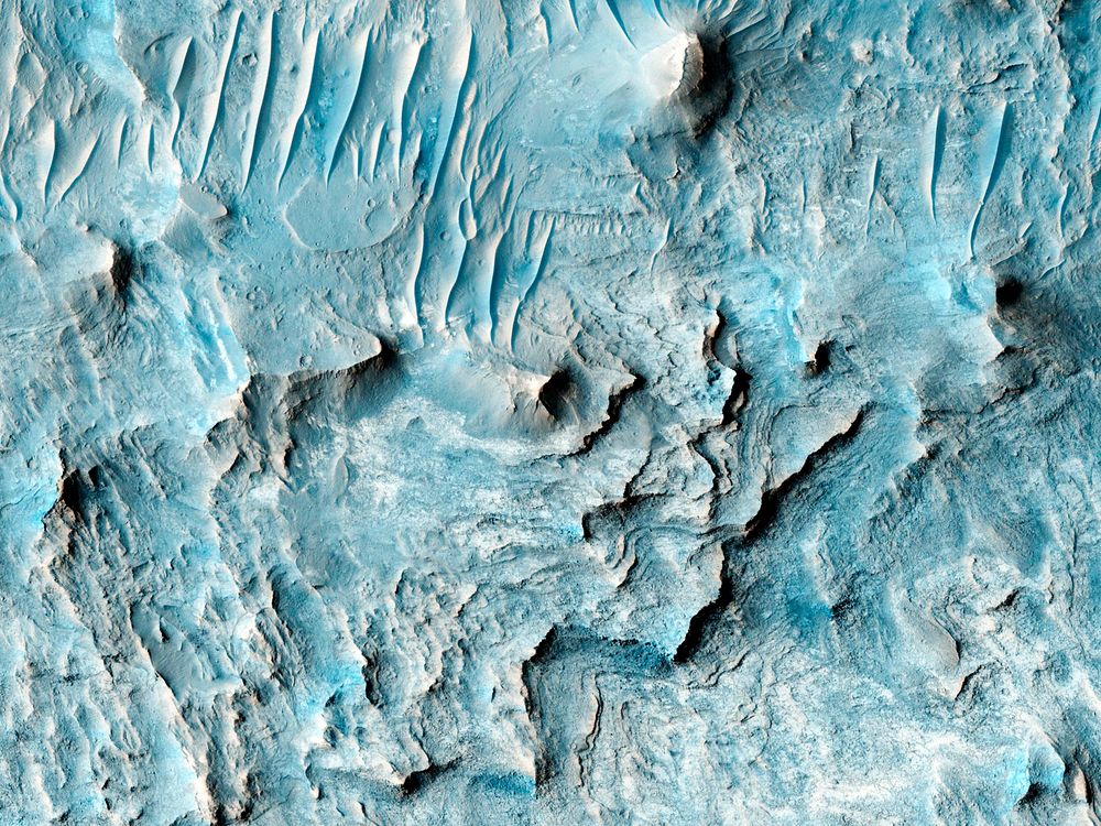 Ius Chasma is one of several canyons that make up Valles Marineris, the largest canyon system in the Solar System. Original…