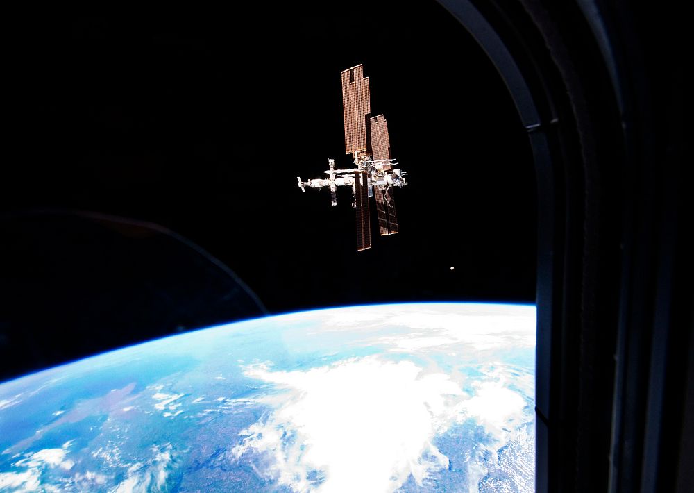 The International Space Station was photographed from the space shuttle Atlantis as the orbiting complex and the shuttle…