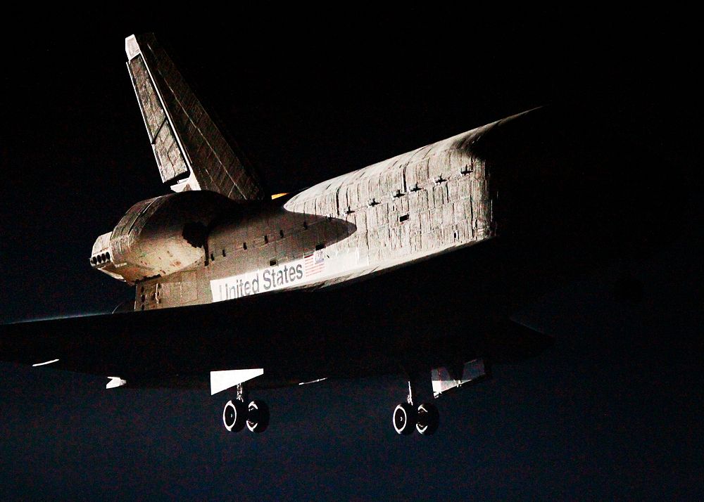 With landing gear down, space shuttle Endeavour nears touchdown on Runway 15 at the Shuttle Landing Facility at NASA's…