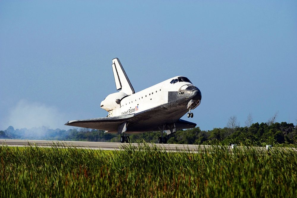 Space shuttle Atlantis' main gear touches down on Runway 33 at the Shuttle Landing Facility at NASA's Kennedy Space Center…