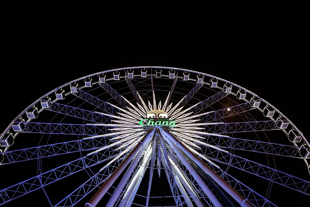 Chang ferries wheel in the night sky at Asiatique. DECEMBER 29, 2020 - BANGKOK, THAILAND
