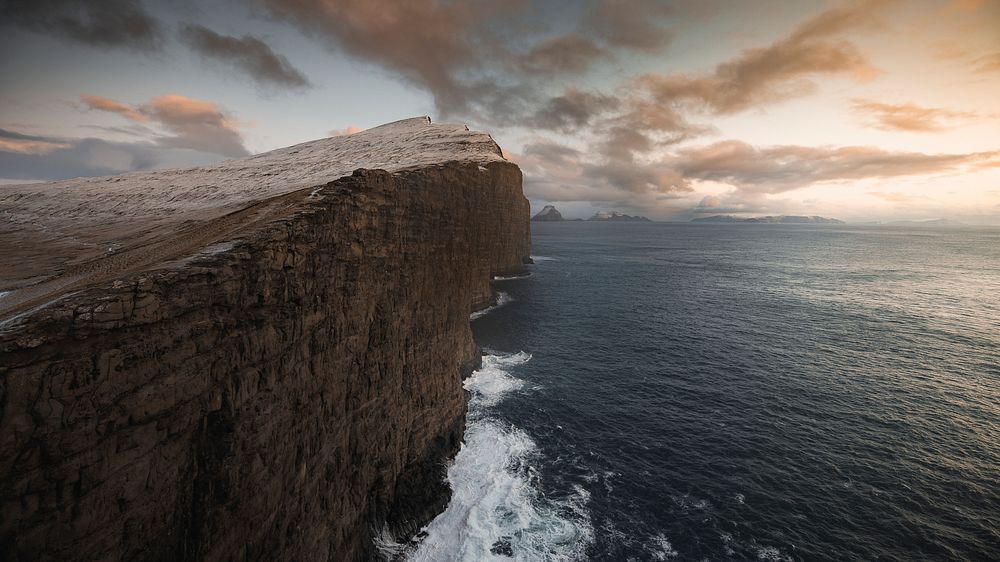 Sunset over the Slave cliff in Faroe islands
