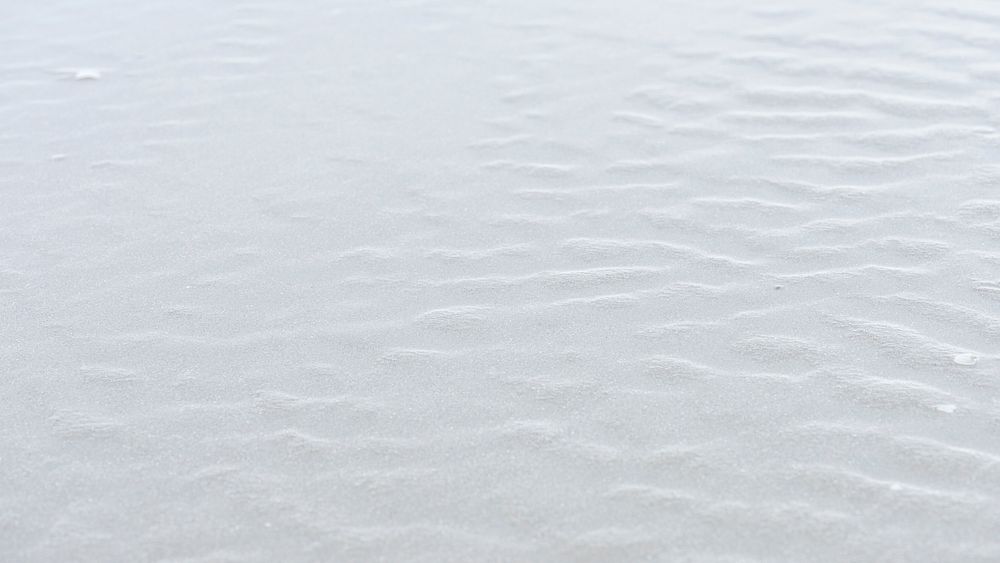 Natural white sand on the beach background