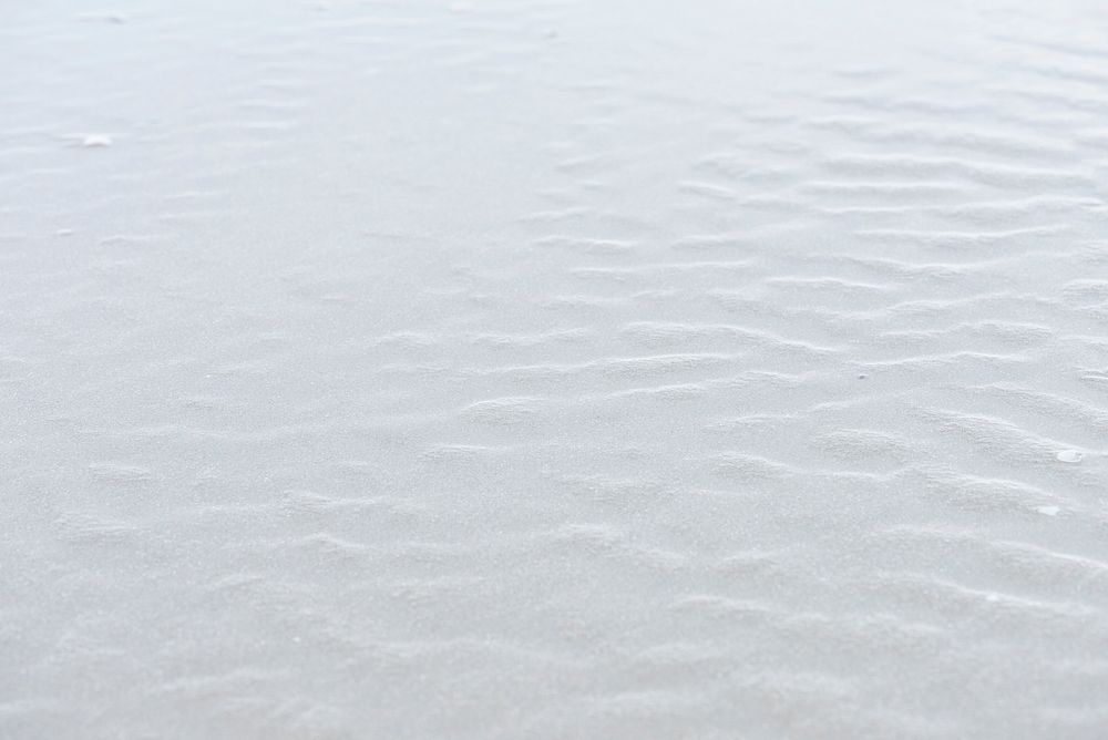 Natural white sand on the beach background