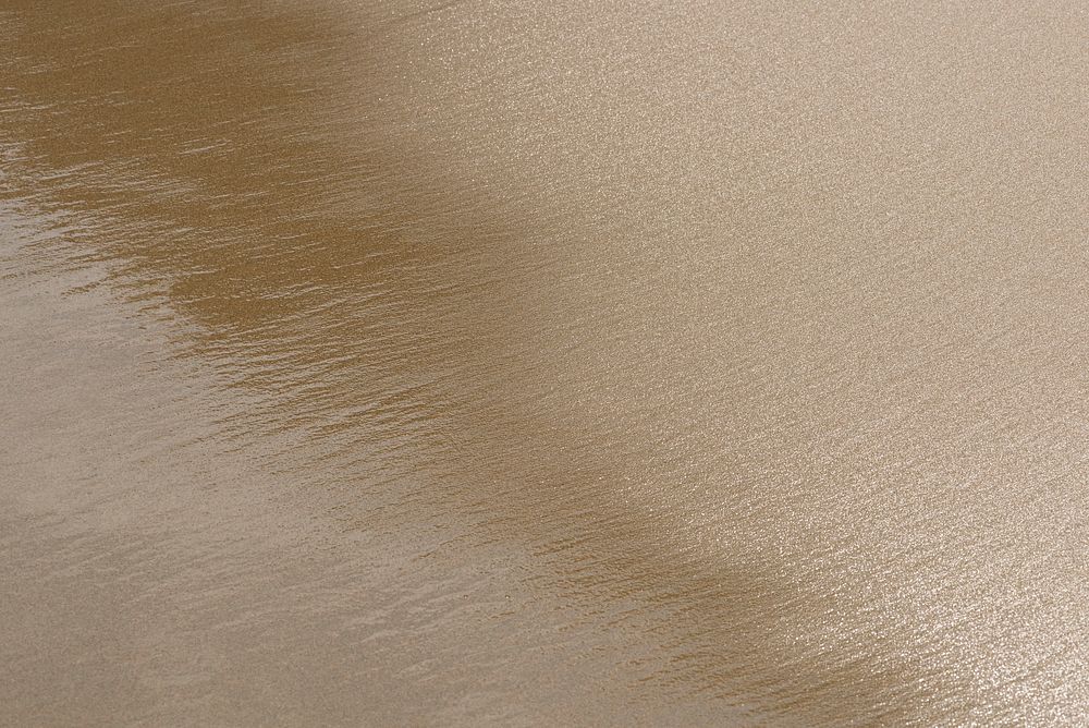Golden sand on the beach background