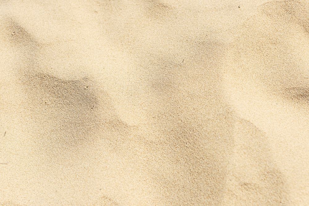 Natural yellow sand on the beach background