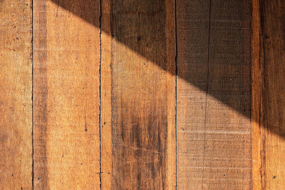 Natural light on brown wooden textured background 