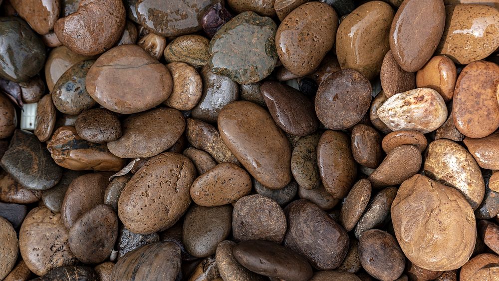 Wet pebbles and rocks on the ground