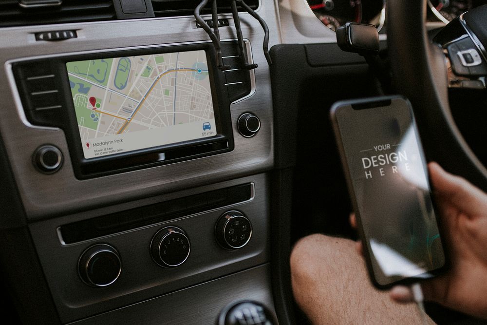 Blank smartphone screen mockup charging in a car