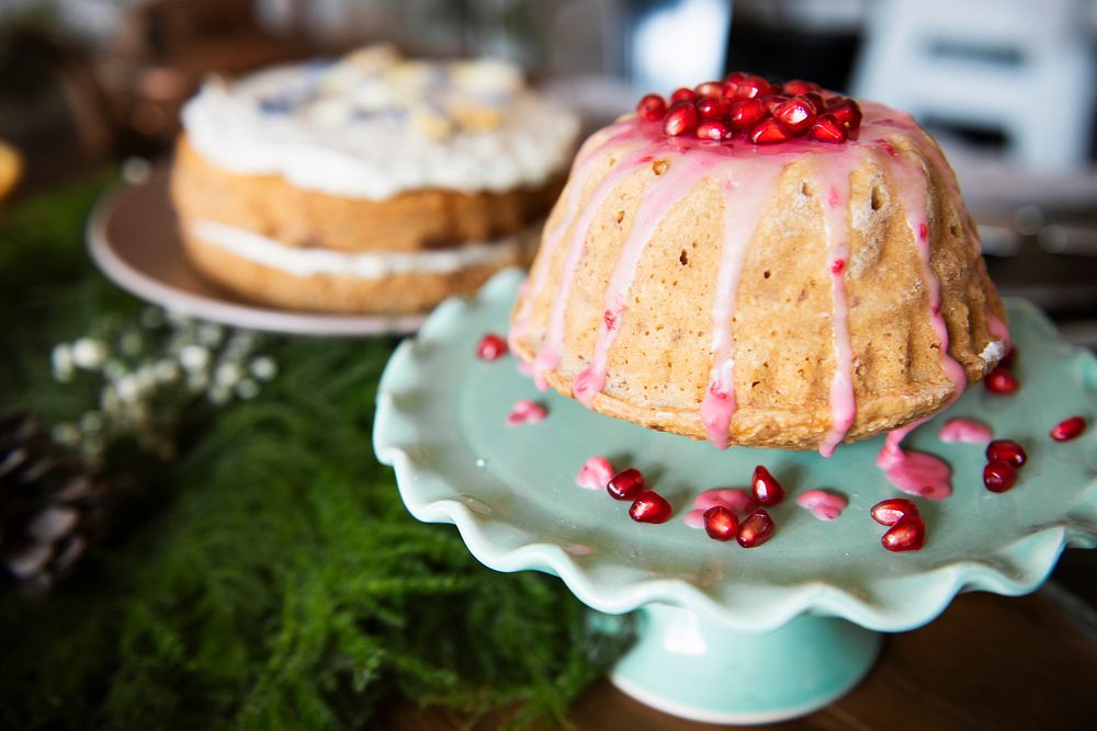 Dome shaped cake topped with pomegranate