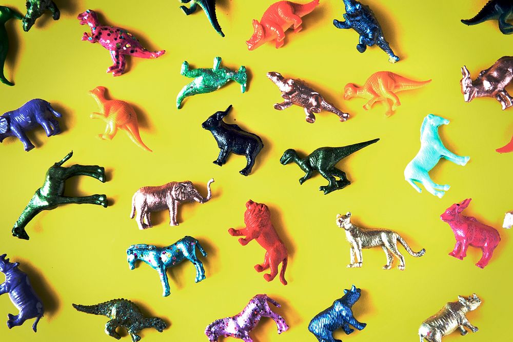 Various animal toy figures in a colorful background