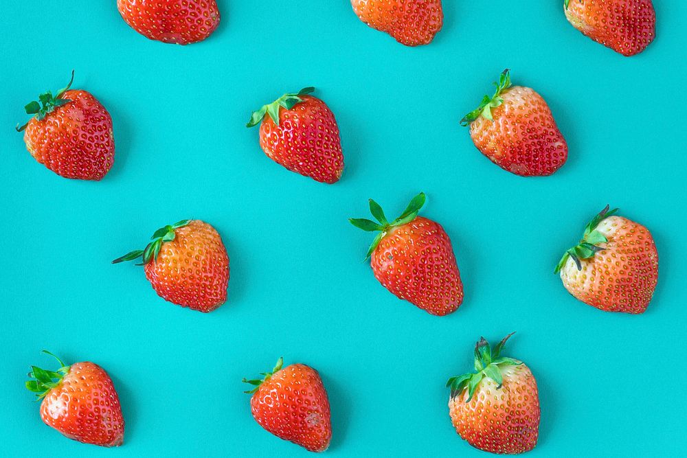 Pattern of yummy strawberries on blue background