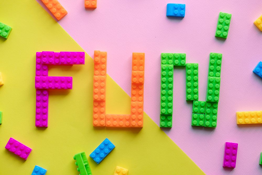 Fun spelled word with plastic blocks background