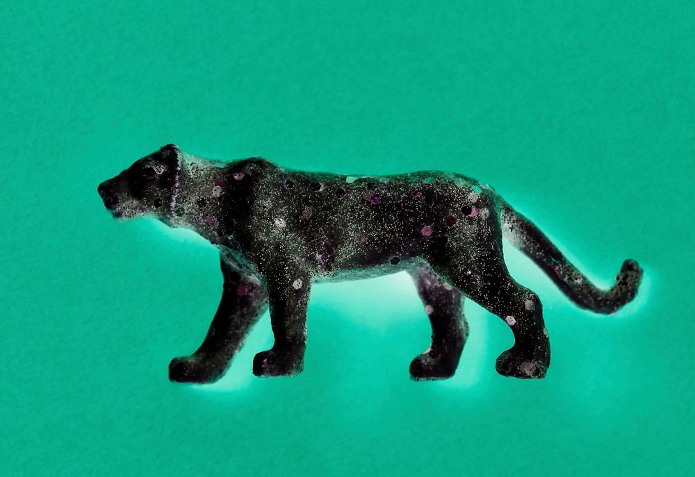Aerial view of shiny animal figurine tiger with effects