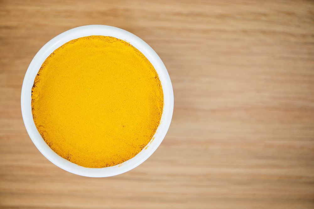 Turmeric power in a white bowl