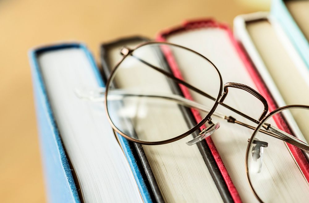 A pair of glasses and books educational, academic and literary concept