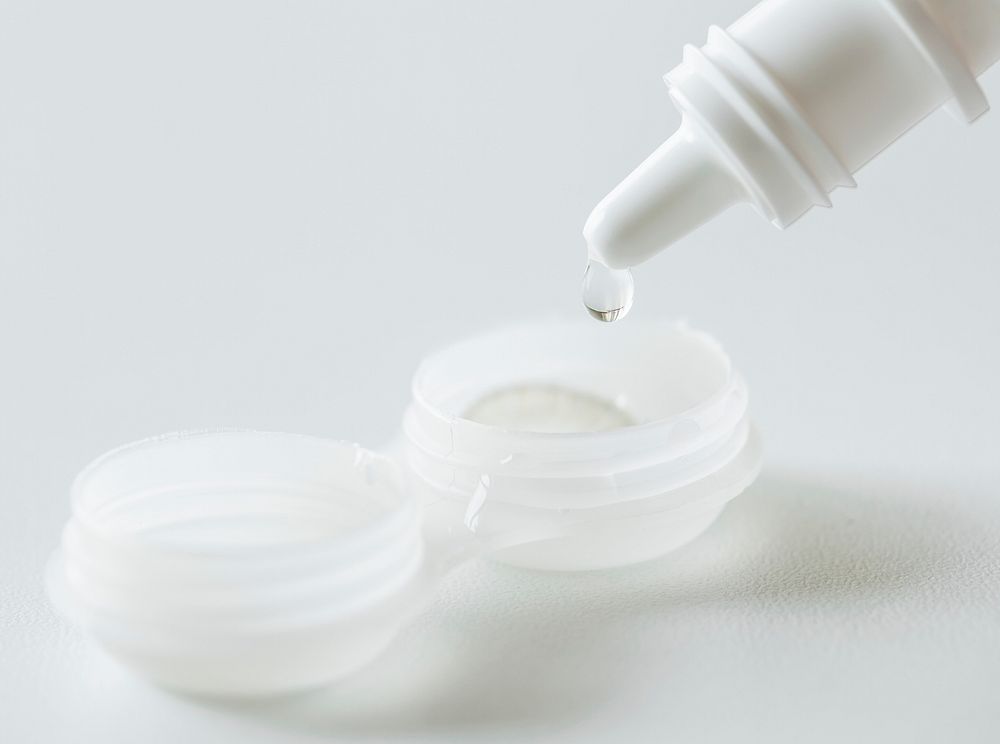 Closeup of contact lens daily cleaning routine concept