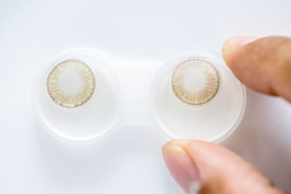 Closeup of colored contact lens in case