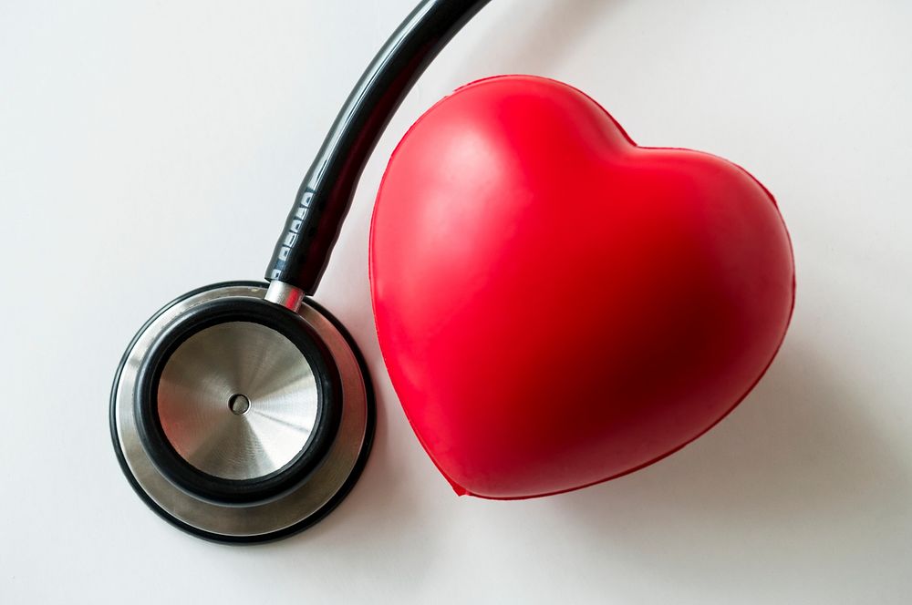 Closeup of heart and a stethoscope cardiovascular checkup concept