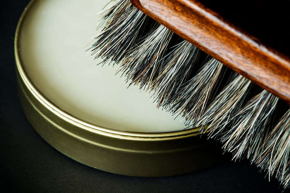 Closeup of shoe brush and polish