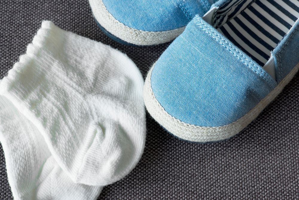 Close up of baby socks and shoes