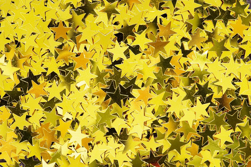 Shiny golden stars glitter festive background