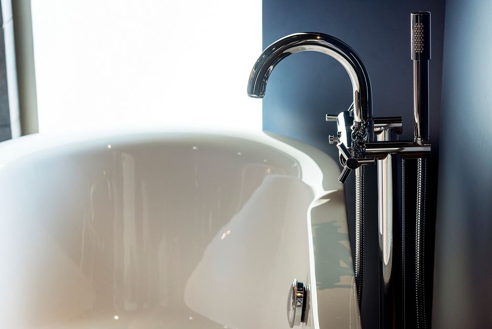 Bathtub faucet closeup with luxury living concept